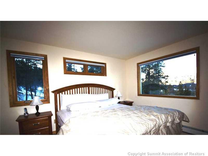 79 Bearing Tree Road Breckenridge, CO 80424 - Photo 7 of 25 a living room with a bed furniture and a large window