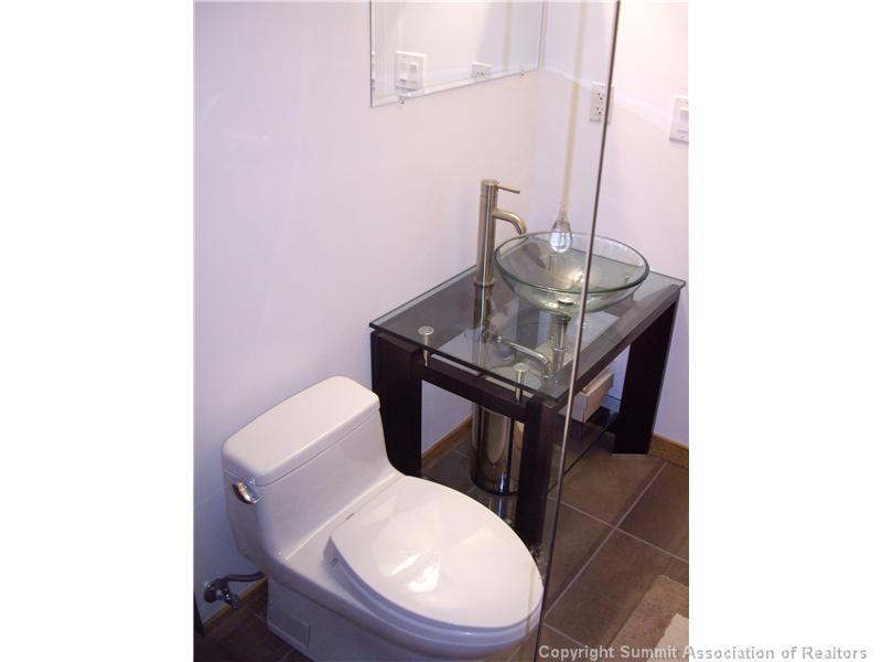 79 Bearing Tree Road Breckenridge, CO 80424 - Photo 9 of 25 a toilet sitting in a bathroom next to a white house