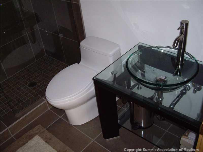 79 Bearing Tree Road Breckenridge, CO 80424 - Photo 10 of 25 a bathroom with a toilet and a sink