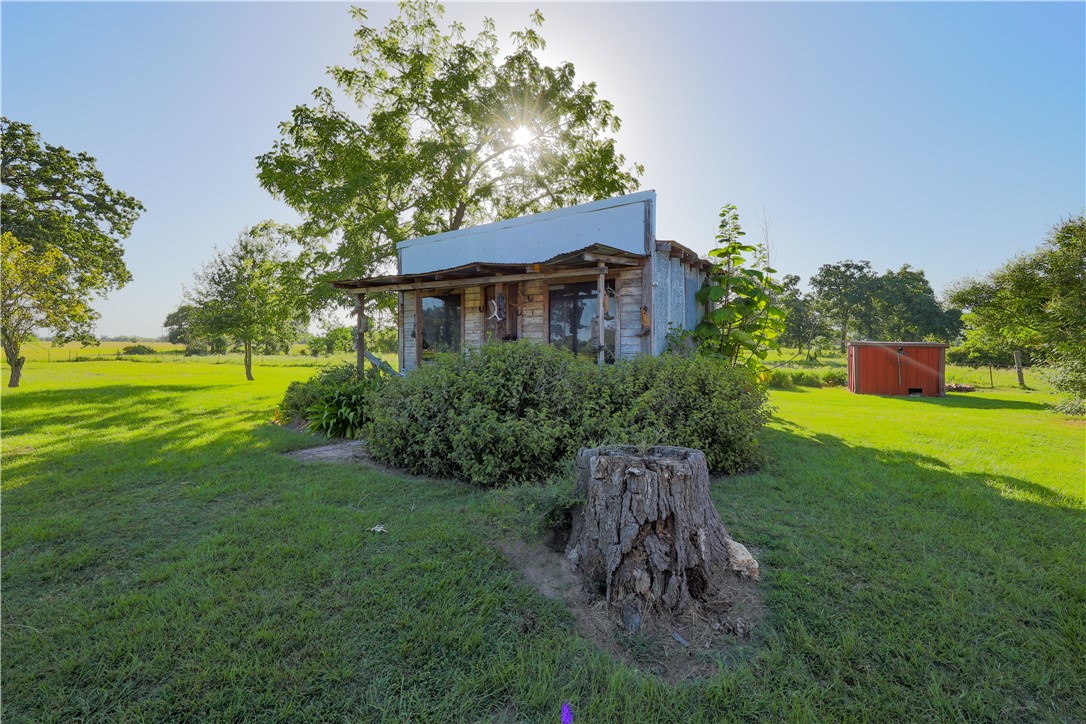 16403-16515 Macey Road Hearne, TX 77859 - Photo 37 of 46 a view of a backyard with plants and a garden