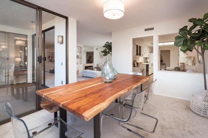 110 Park Road, Unit 108 Burlingame, CA 94010 - Photo 11 of 27 a dining room with a table chairs and entryway