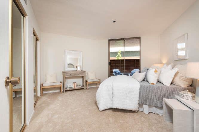 110 Park Road, Unit 108 Burlingame, CA 94010 - Photo 20 of 27 a bedroom with a bed and a window
