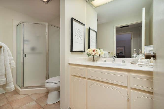 110 Park Road, Unit 108 Burlingame, CA 94010 - Photo 21 of 27 a bathroom with a toilet sink and shower