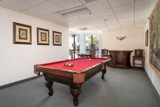 110 Park Road, Unit 108 Burlingame, CA 94010 - Photo 25 of 27 a room with pool table and wall paintings