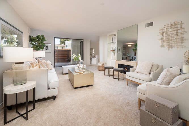 110 Park Road, Unit 108 Burlingame, CA 94010 - Photo 4 of 27 a living room with furniture and a large window