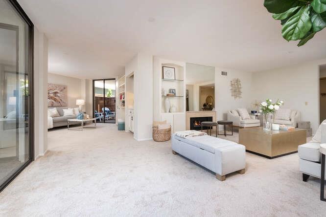 110 Park Road, Unit 108 Burlingame, CA 94010 - Photo 6 of 27 a view of a livingroom with furniture and a flat screen tv