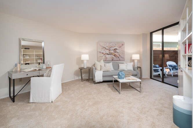 110 Park Road, Unit 108 Burlingame, CA 94010 - Photo 7 of 27 a living room with furniture and a large window
