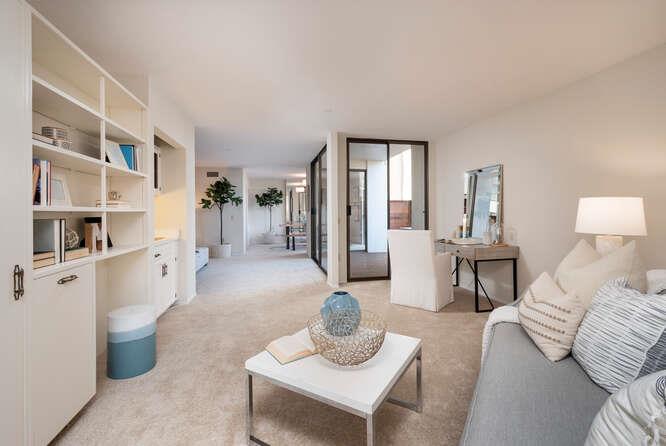 110 Park Road, Unit 108 Burlingame, CA 94010 - Photo 8 of 27 a living room with furniture and a wooden floor