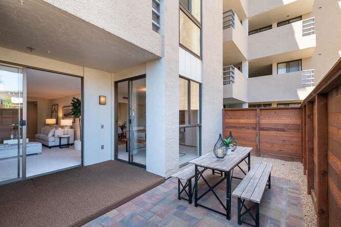 110 Park Road, Unit 108 Burlingame, CA 94010 - Photo 10 of 27 a patio with table and chairs