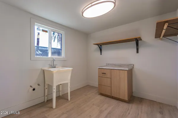 a room with a window and wooden floor