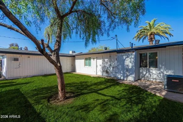 a view of a house with a yard