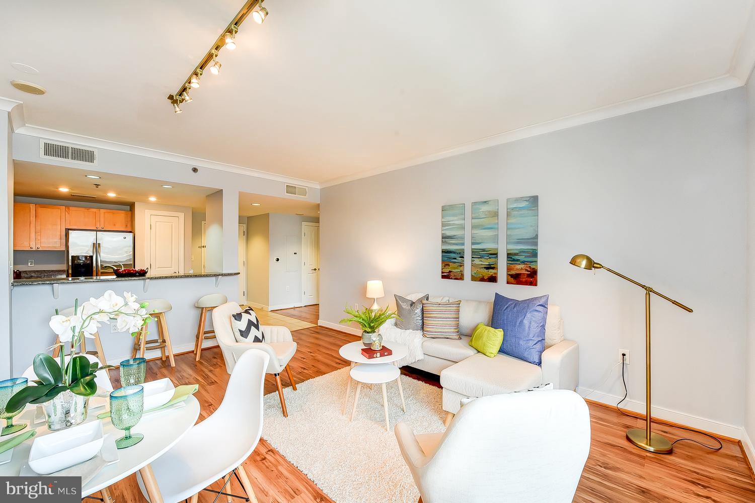777 7th Street Northwest, Unit 924 Washington, DC 20001 - Photo 11 of 25 a living room with furniture and a large window