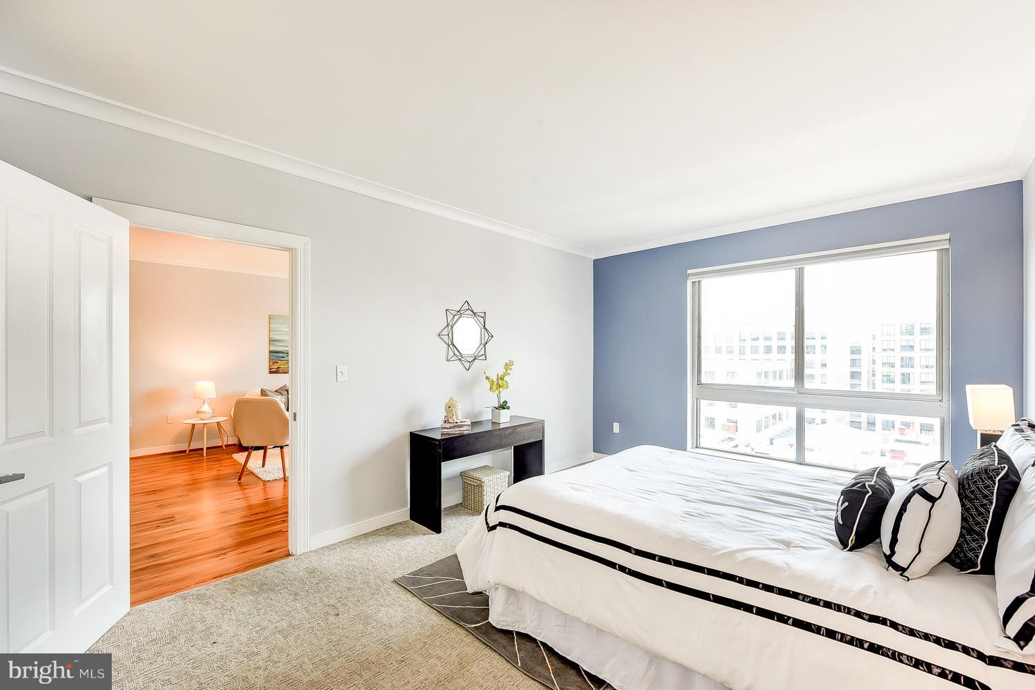 777 7th Street Northwest, Unit 924 Washington, DC 20001 - Photo 15 of 25 a bedroom with a bed and a large window