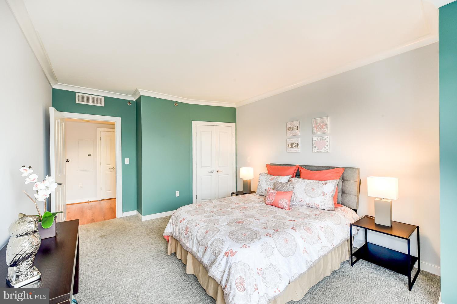 777 7th Street Northwest, Unit 924 Washington, DC 20001 - Photo 21 of 25 a bedroom with a bed and a window