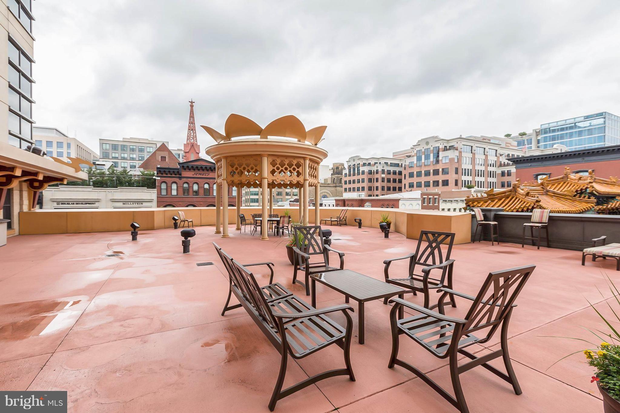 777 7th Street Northwest, Unit 924 Washington, DC 20001 - Photo 25 of 25 a view of a terrace with furniture and city view