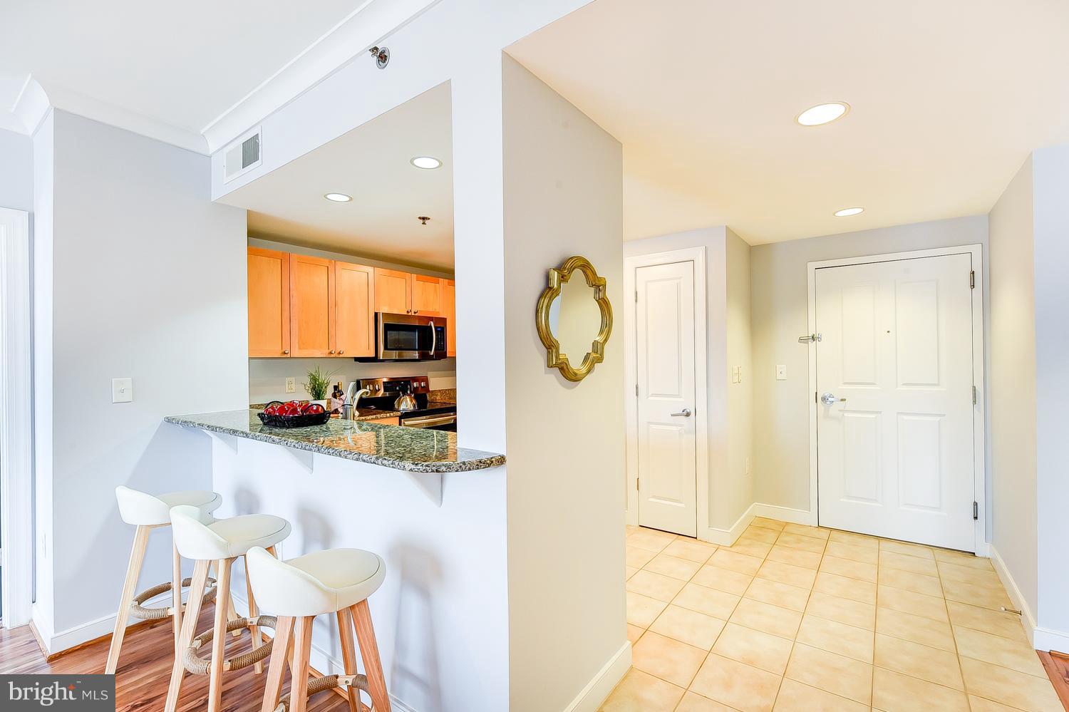 777 7th Street Northwest, Unit 924 Washington, DC 20001 - Photo 9 of 25 a view of a kitchen and dining room