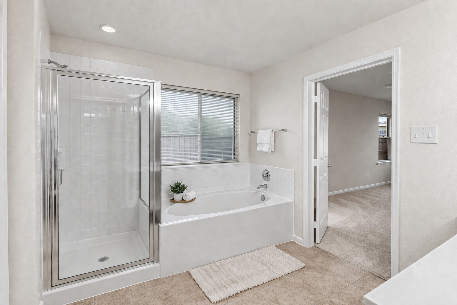 3522 Brackenfern Road Katy, TX 77449 - Photo 12 of 17 a bathroom with a bathtub and a shower