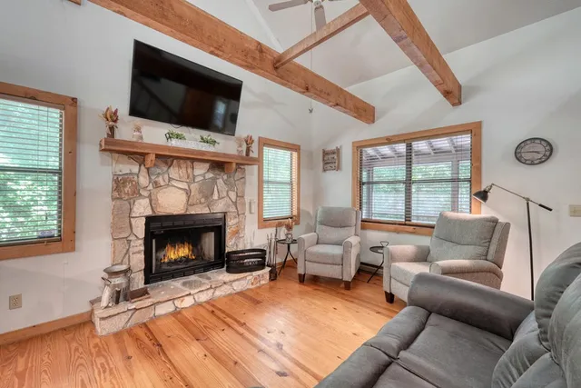 a dining room with furniture window and wooden floor