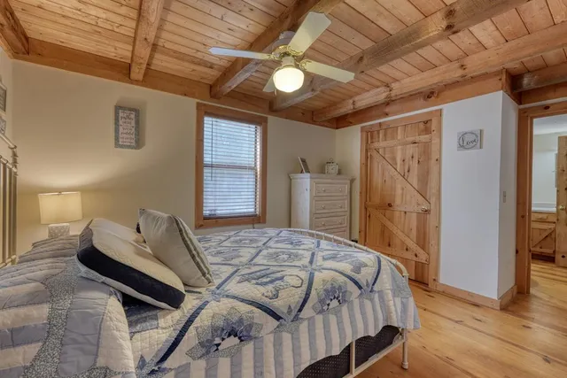a bathroom with a sink a mirror and shower