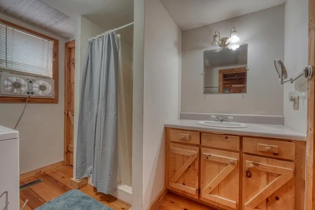a view of a living room and dining room with furniture