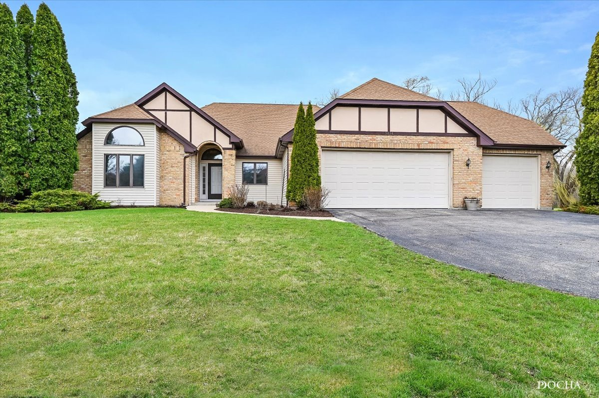 9638 Book Road Naperville, IL 60564 - Photo 1 of 44 a front view of a house with a yard and garage