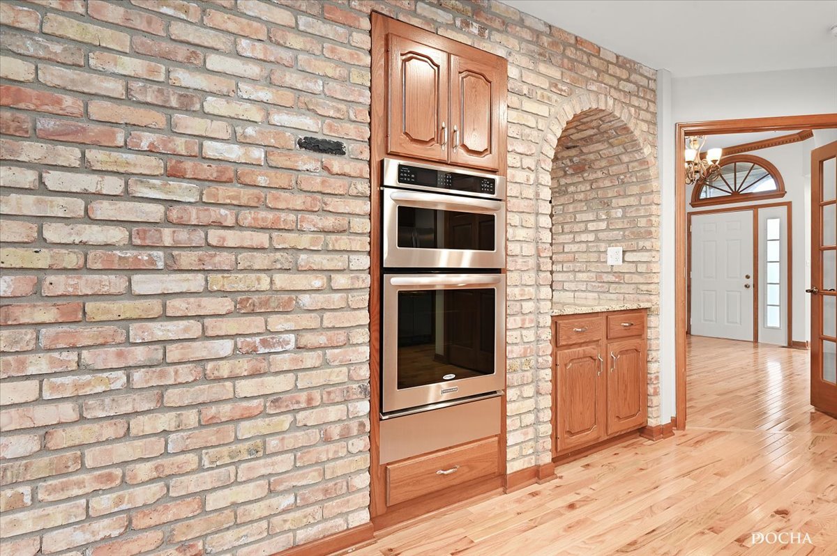 9638 Book Road Naperville, IL 60564 - Photo 12 of 44 a kitchen with granite countertop stainless steel appliances and wooden floor