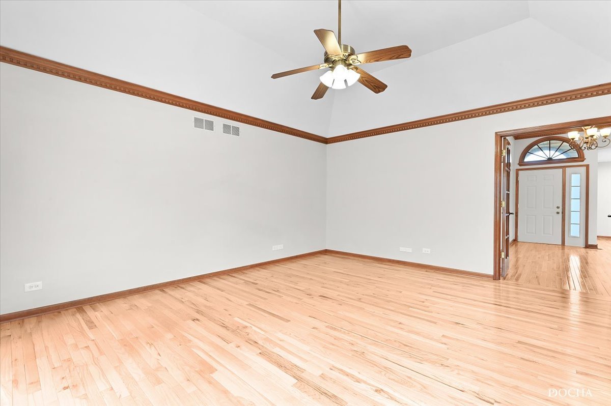 9638 Book Road Naperville, IL 60564 - Photo 19 of 44 a view of an empty room with a window and wooden floor