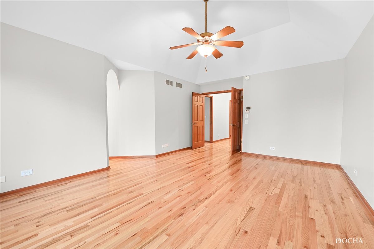 9638 Book Road Naperville, IL 60564 - Photo 22 of 44 a view of an empty room with wooden floor and a window