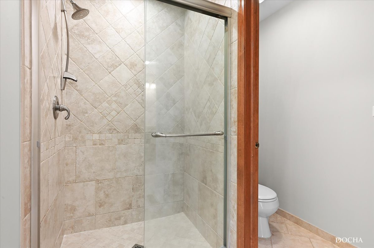 9638 Book Road Naperville, IL 60564 - Photo 27 of 44 a bathroom with a glass shower door