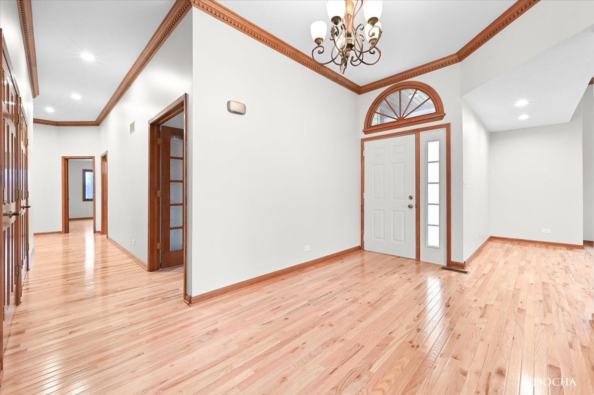 9638 Book Road Naperville, IL 60564 - Photo 3 of 44 a view of a hallway with wooden floor