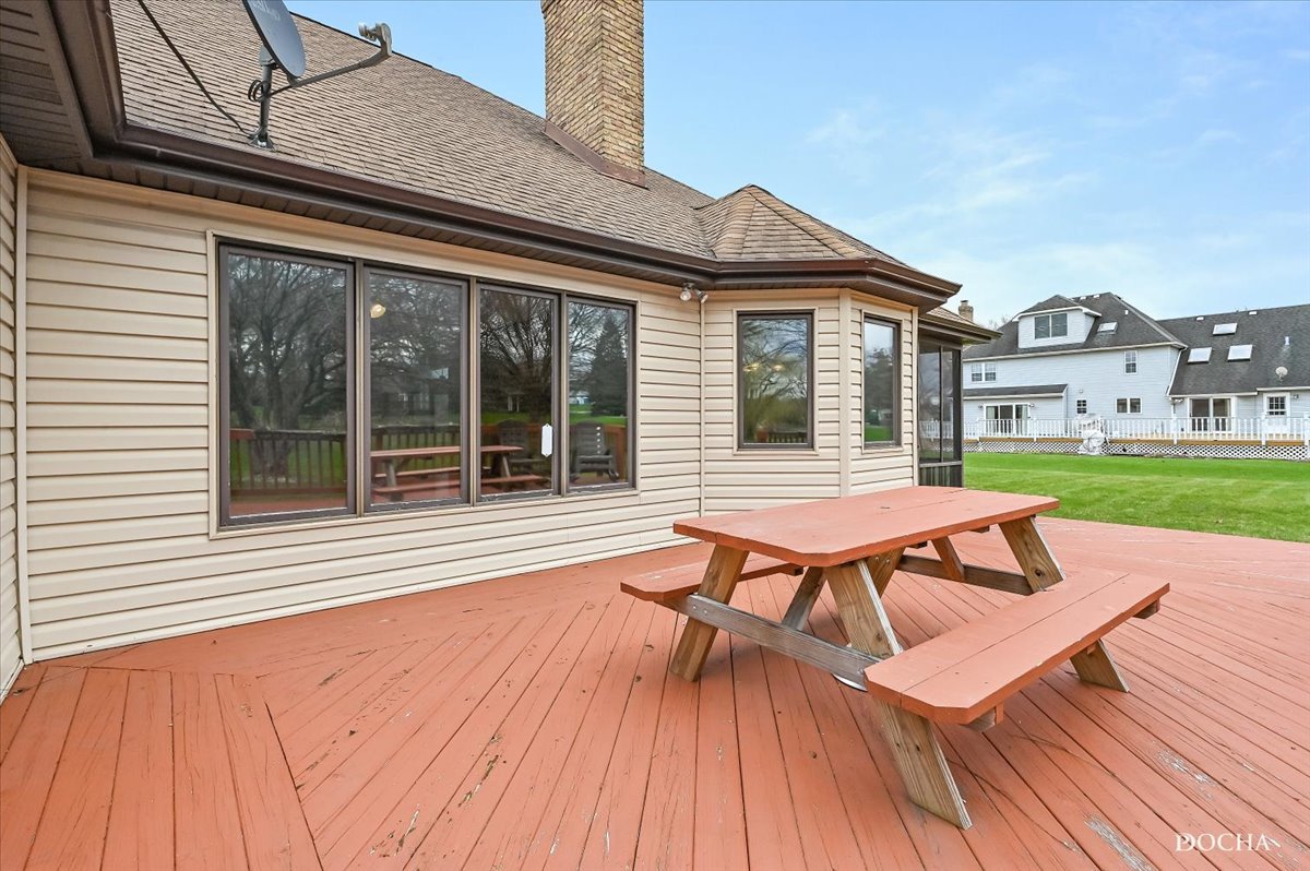 9638 Book Road Naperville, IL 60564 - Photo 38 of 44 a view of a patio with table and chairs with wooden floor and fence