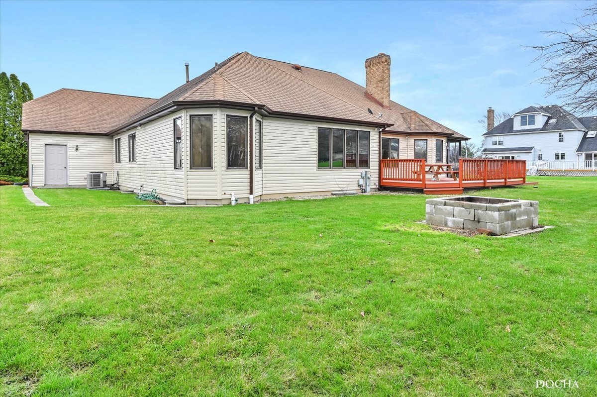 9638 Book Road Naperville, IL 60564 - Photo 41 of 44 a front view of a house with a garden and deck