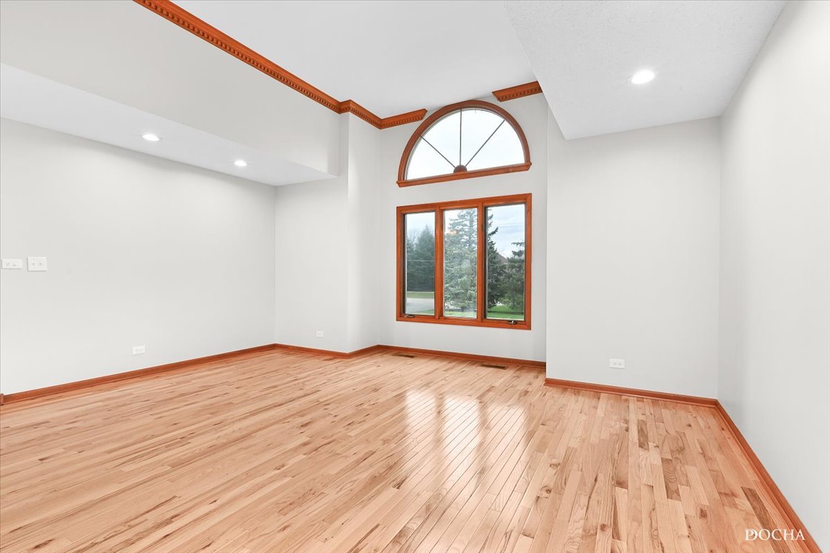 9638 Book Road Naperville, IL 60564 - Photo 6 of 44 a view of empty room with wooden floor and fan