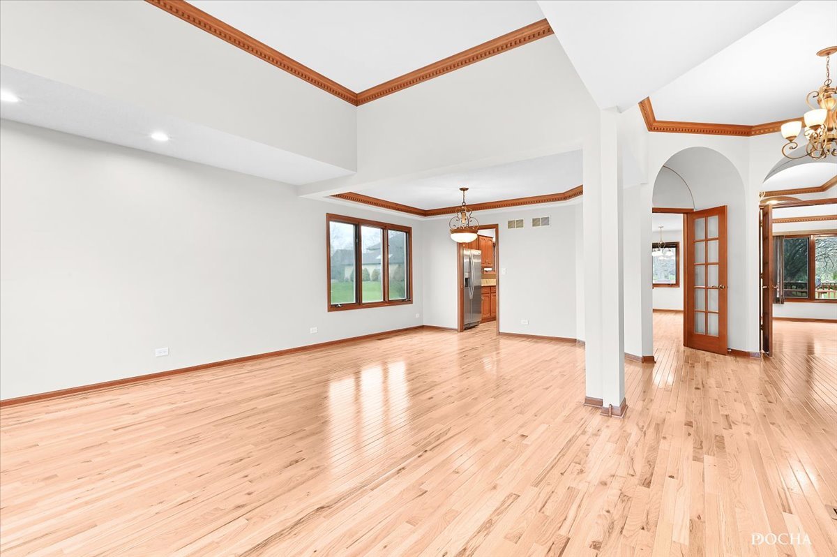 9638 Book Road Naperville, IL 60564 - Photo 7 of 44 a view of an empty room with wooden floor and a window