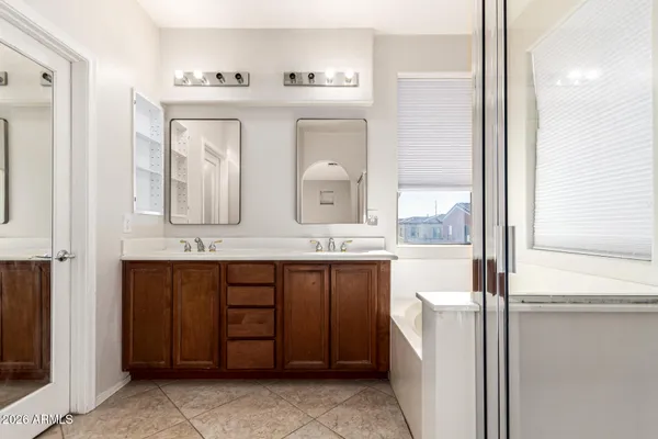a bathroom with a shower and a sink