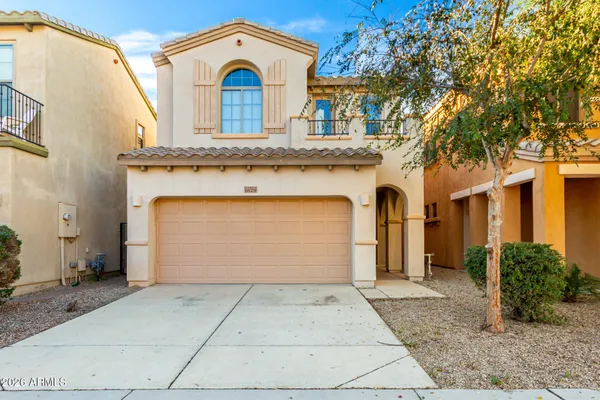 a front view of a house with a garage
