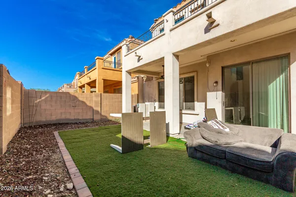 a view of a house with backyard and porch