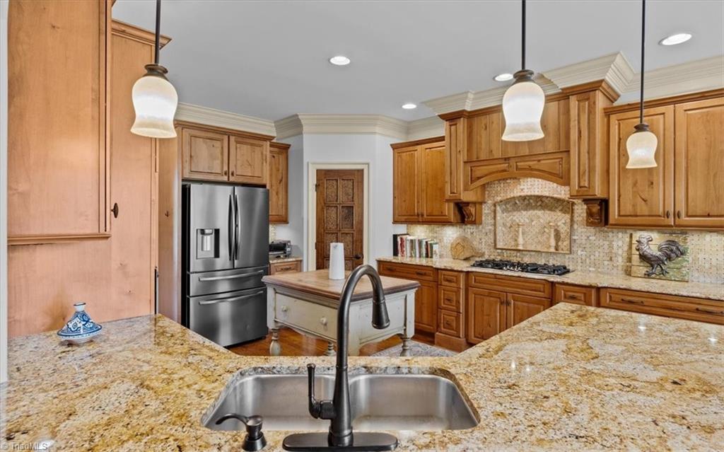 7787 Sutter Road Greensboro, NC 27455 - Photo 11 of 50 Elegant kitchen designed with a chef in mind