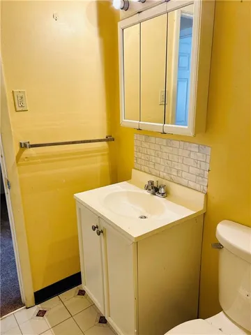 a bathroom with a sink and toilet