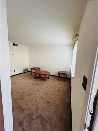 a view of a room with racks on the wall