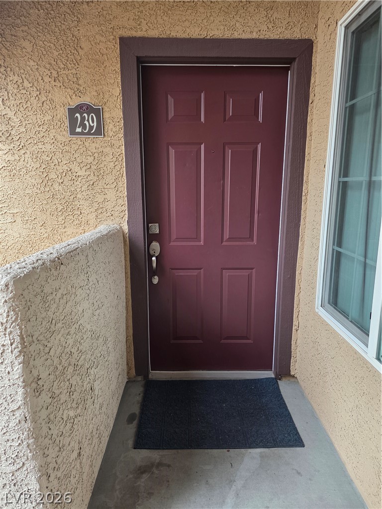 9325 West Desert Inn Road, Unit 239 Las Vegas, NV 89117 - Photo 2 of 29 View of exterior entry featuring stucco siding