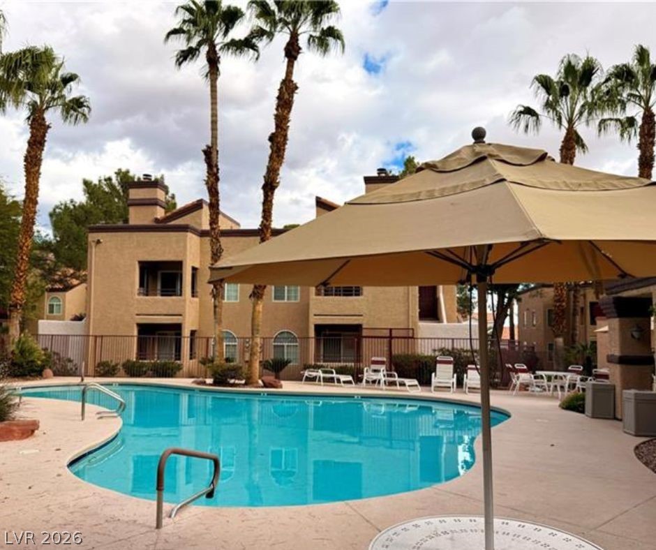 9325 West Desert Inn Road, Unit 239 Las Vegas, NV 89117 - Photo 25 of 29 Community pool with a patio