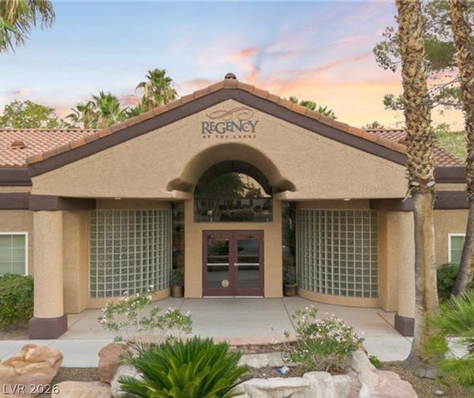 9325 West Desert Inn Road, Unit 239 Las Vegas, NV 89117 - Photo 29 of 29 Exterior entry at dusk with stucco siding, french doors, and a tiled roof