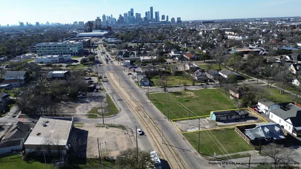 an aerial view of a city with lots of residential buildings
