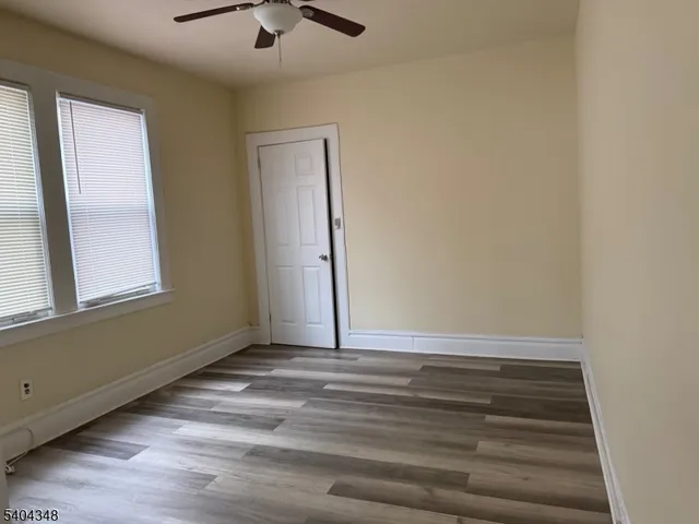 a view of room with window and hardwood floor