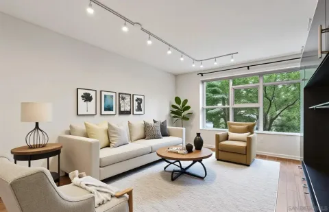 a living room with furniture and a large window