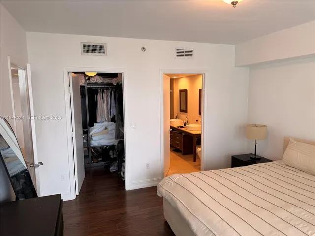 a bathroom with 2 sink and a mirror