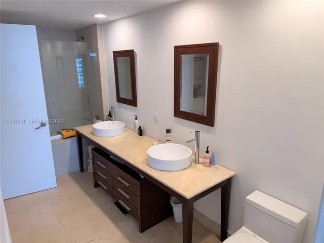 a view of a swimming pool with outdoor seating