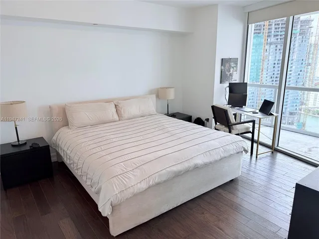a bathroom with a sink double vanity and a potted plant