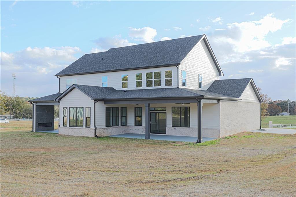 1341 Wheeler Creek Road Maysville, GA 30558 - Photo 51 of 51 a front view of a house with a garden